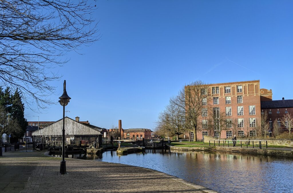 Photo of a small town with a river on a beautiful sunny day - Best Rate